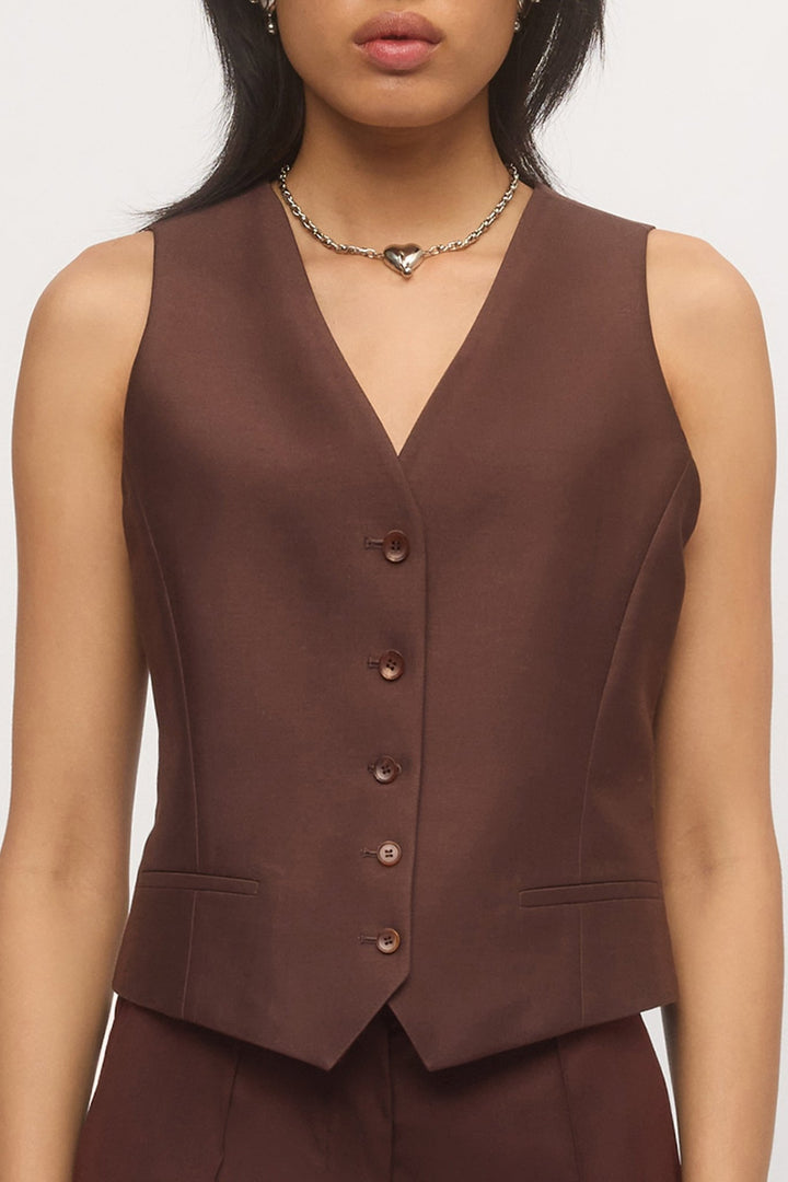 Close-up front detail of Button Down Vest – showing button front and v-neck cut.
