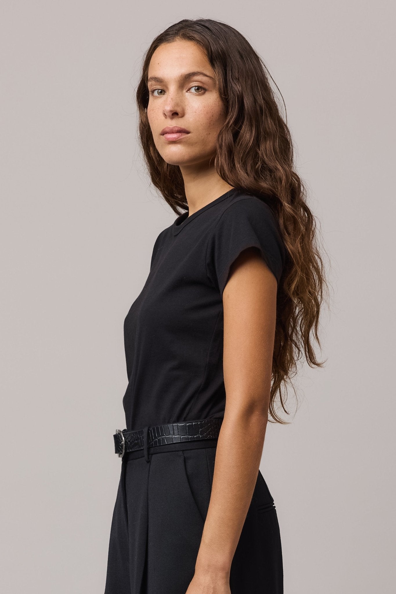 Close-up of a woman in the soft black organic cotton girlfriend tee.