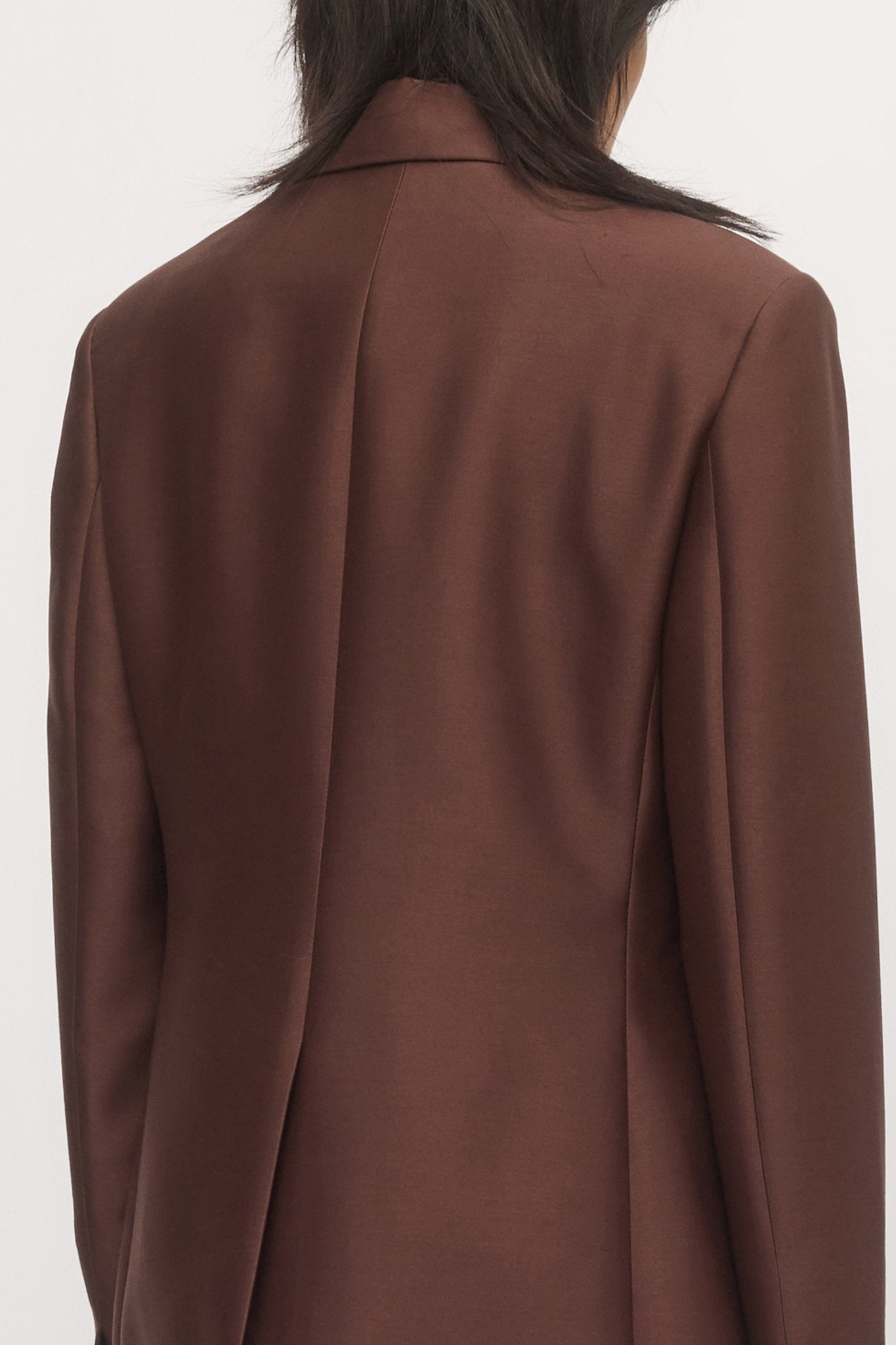 Back view of woman wearing Single Button Blazer mahogany wool suit โ Skin and Threads