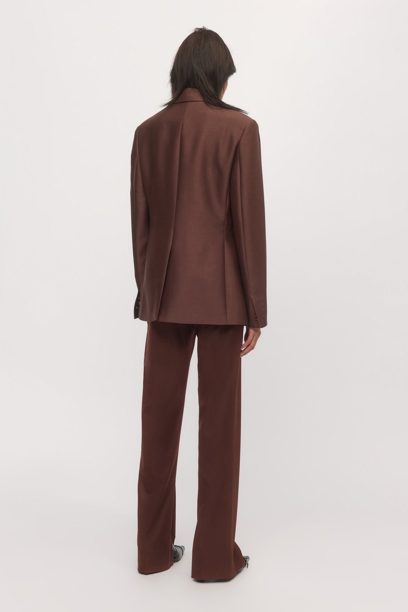Back view of woman in Single Button Blazer mahogany with full suiting set โ Skin and Threads