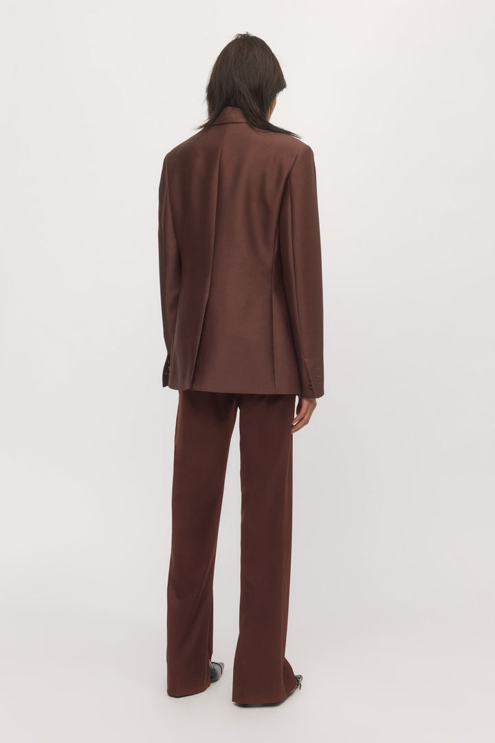 Back view of woman in Single Button Blazer mahogany with full suiting set โ Skin and Threads