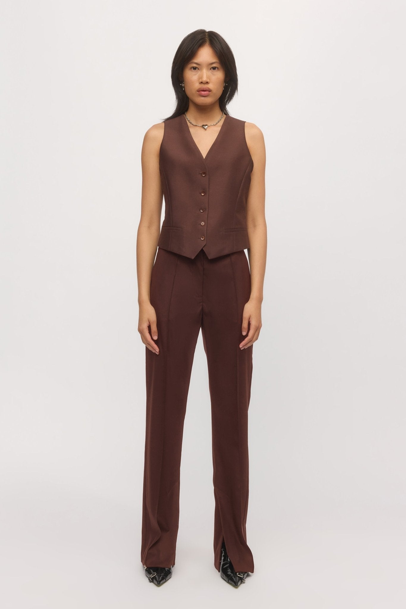 Front view of woman wearing Split Leg Trouser in mahogany with matching tailored vest โ Skin and Threads