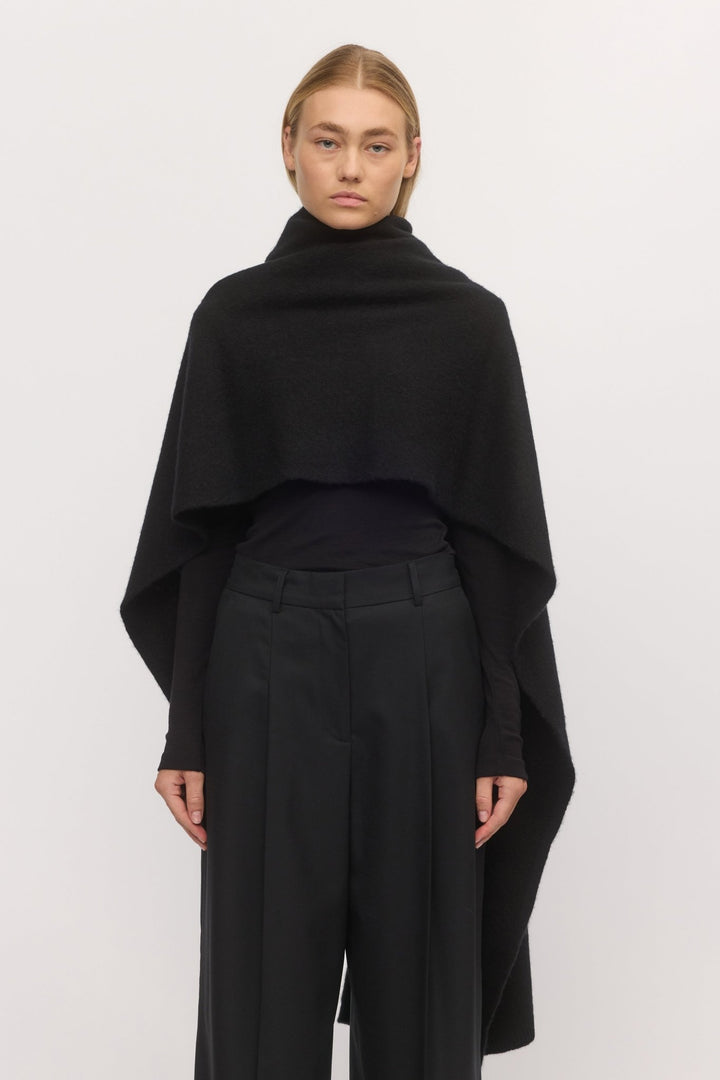 Woman wearing the Brushed Anywhere Wrap in Midnight – front view of deep navy wool-cashmere wrap with soft brushed texture and elegant drape.