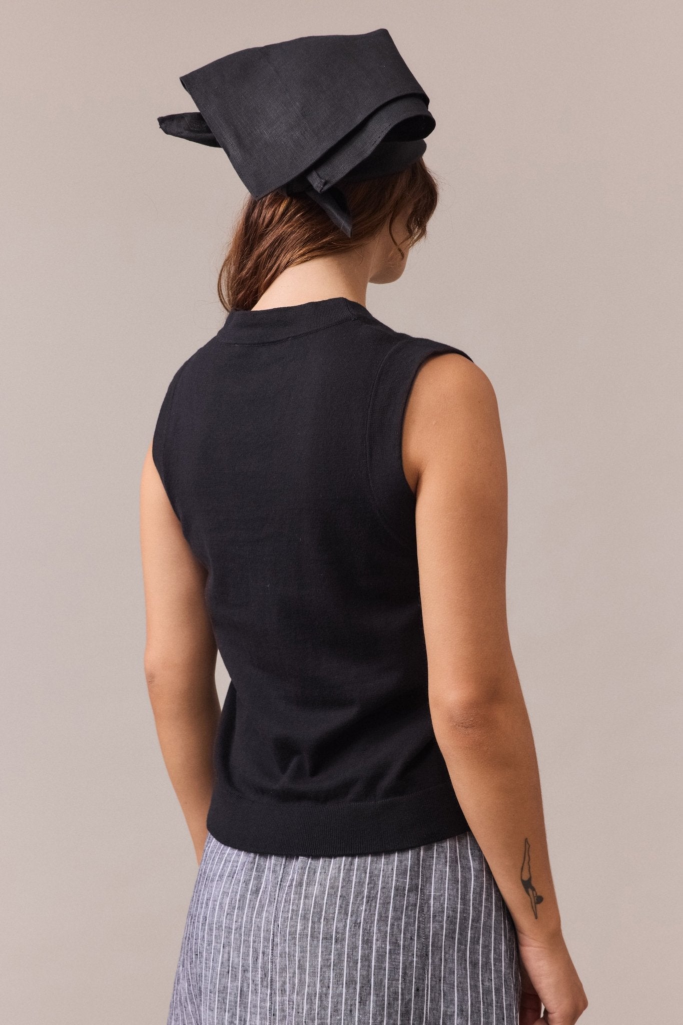 black cotton-cashmere button-up vest seen from the back