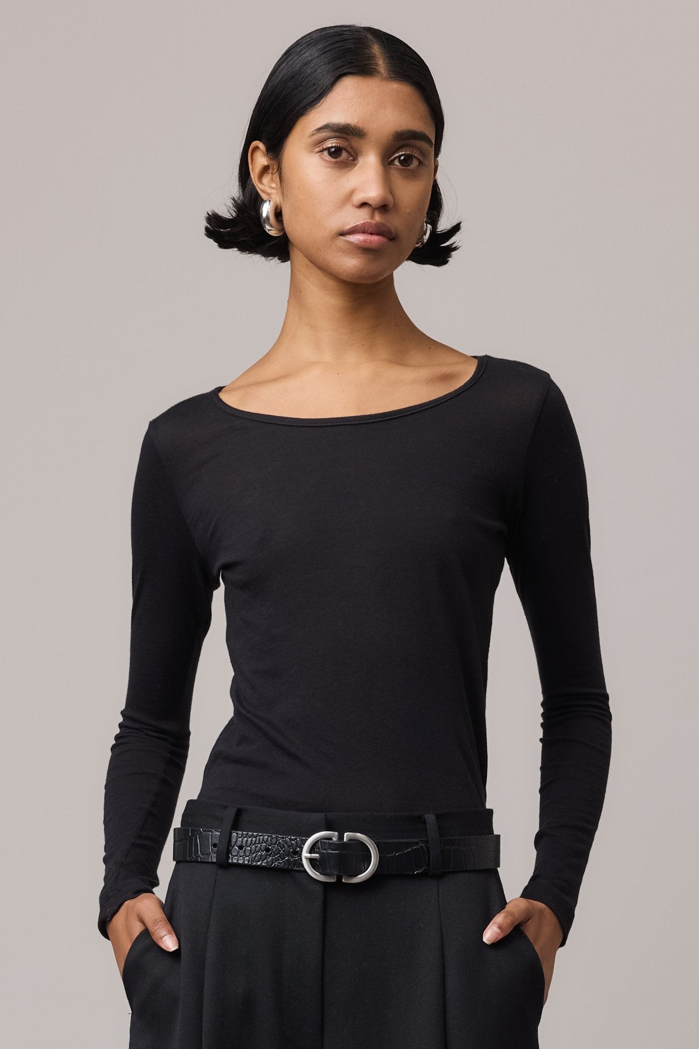  Close-up of the woman wearing the soft black cotton top.