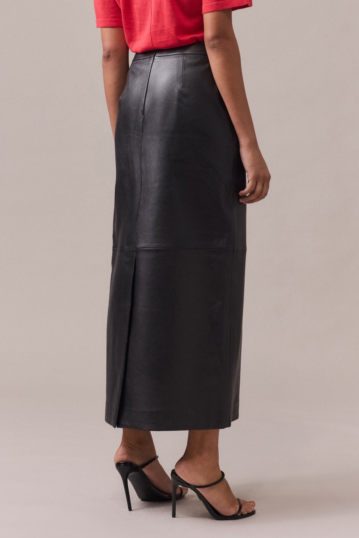 Women's Zara leather maxi skirt seen from the behind.