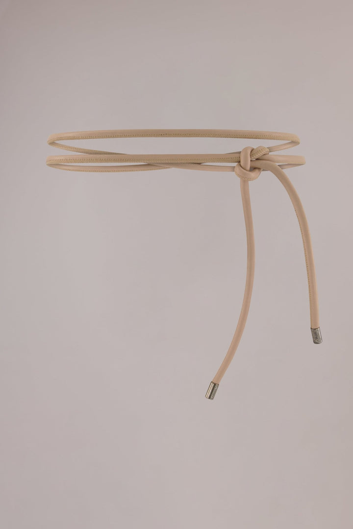 Women's brown leather wrap belt with whipstitch detailing and gunmetal cylinder ends.
