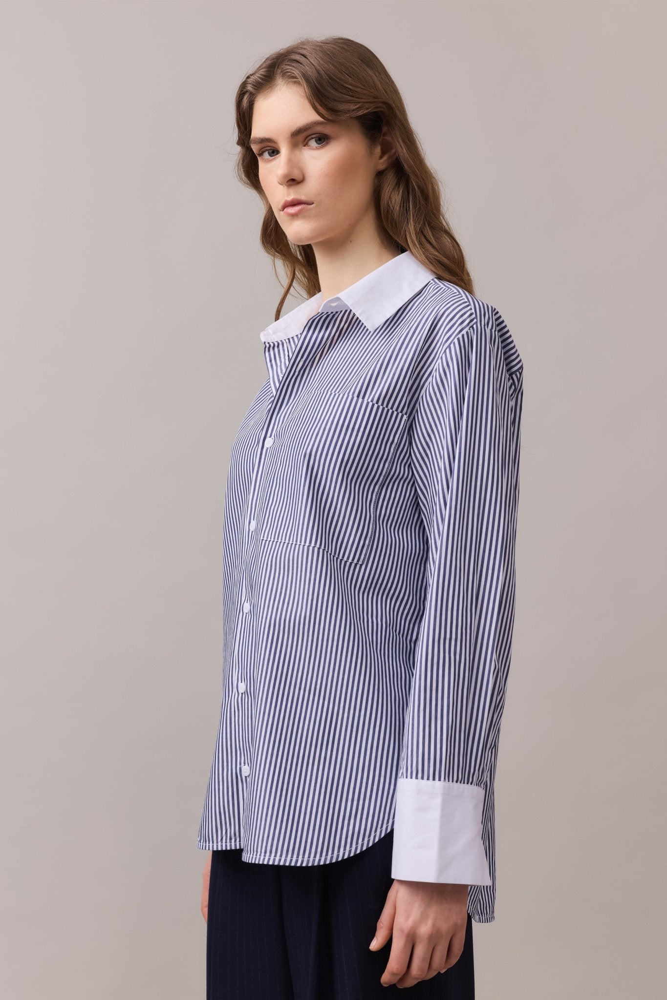 Close-up of the Lenny Stripe Shirt, highlighting the contrast white collar, white cuffs, front patch pocket, and clean button-through placket.