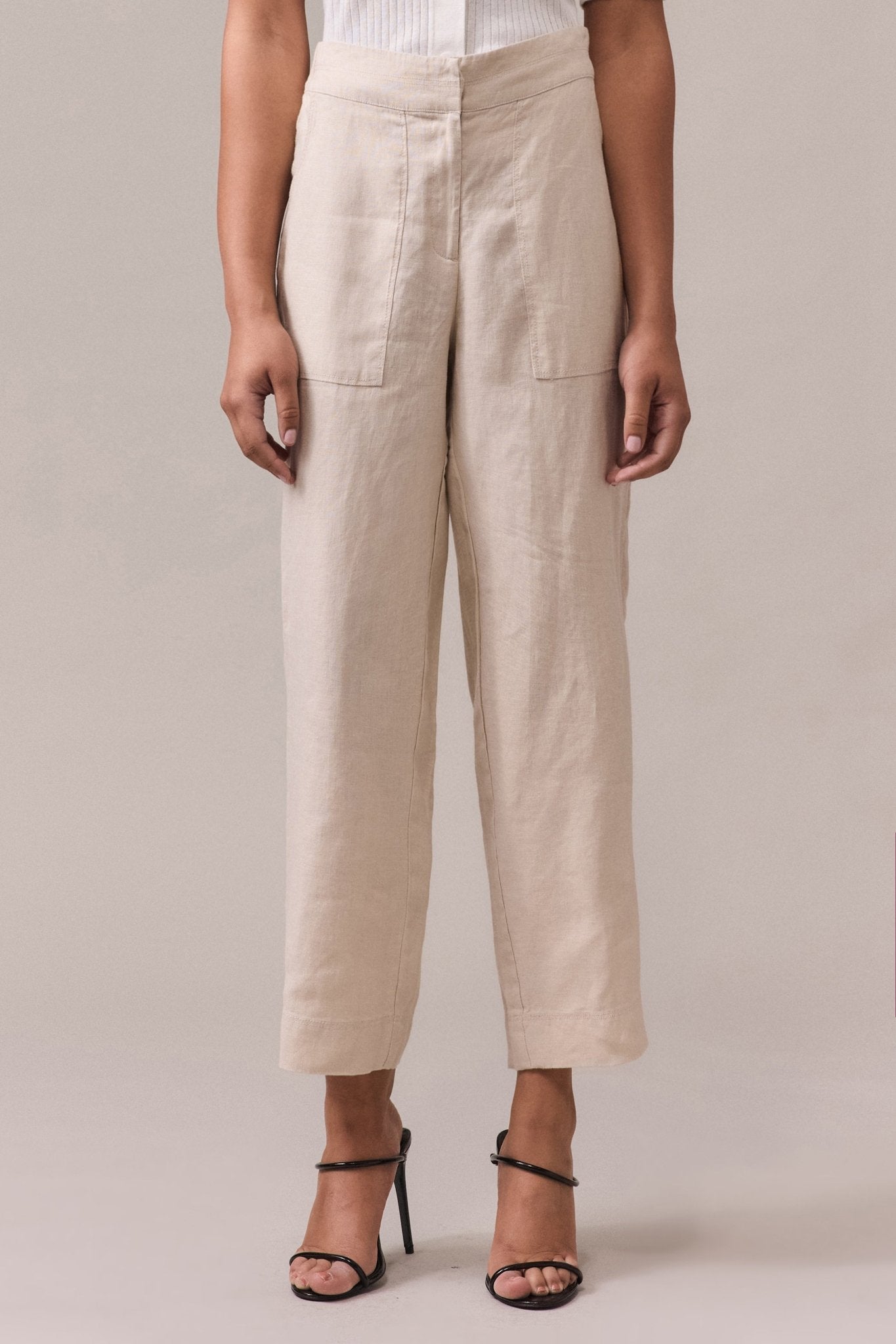 Woman's slim-fit 100% linen pant with a slightly cropped length, tailored front waist, and elasticated back waist.