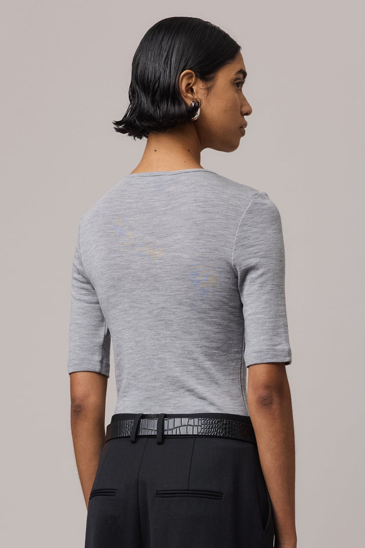 Close-up from behind of a grey Merino Wool Crew Neck Tee, showcasing its soft texture and clean design.