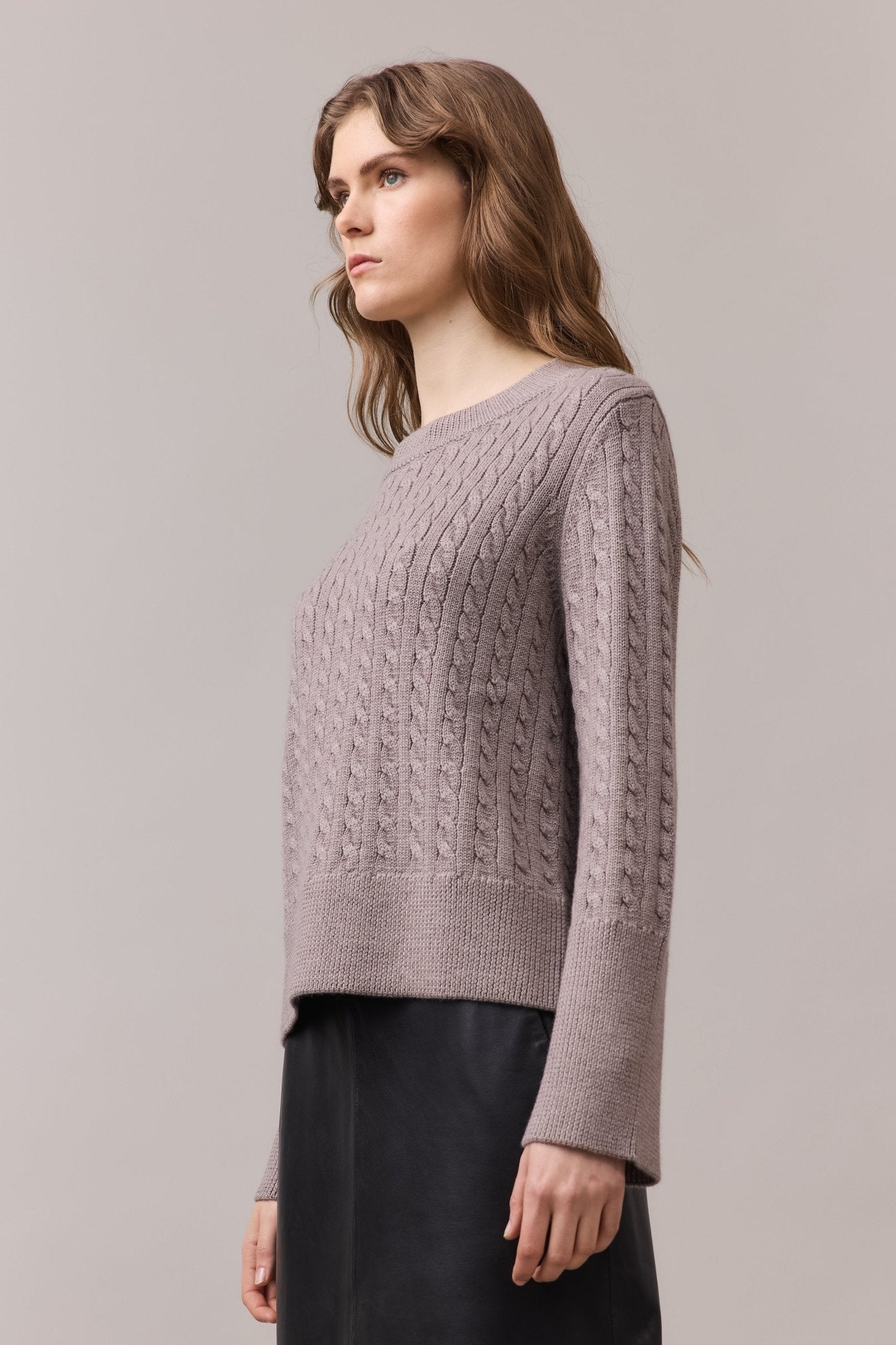 Women's merino wool knit sweather with long sleeves.