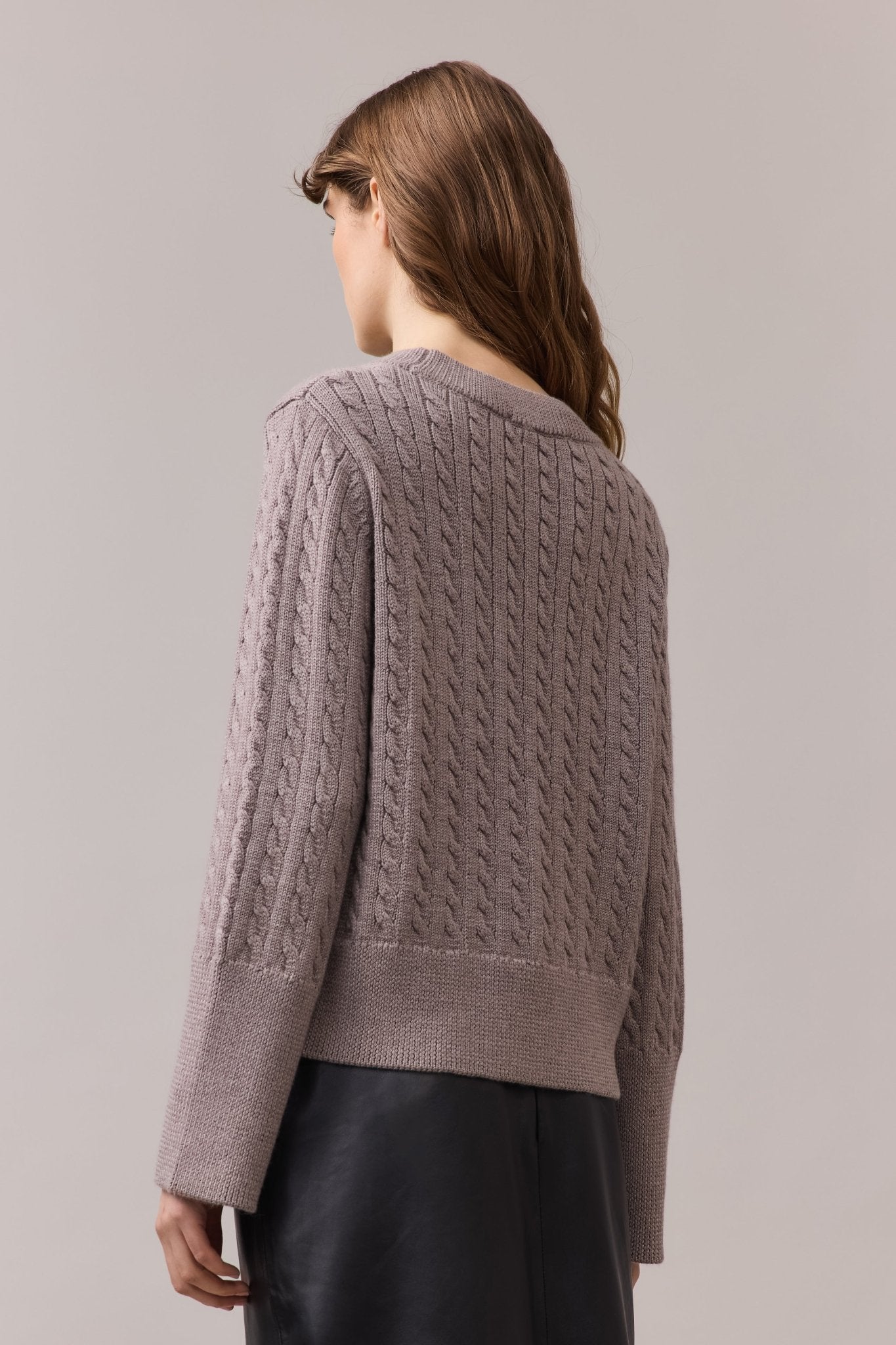 Women's merino wool knit sweater seen from back